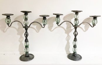 A Pair Of Glass And Metal Candleabra
