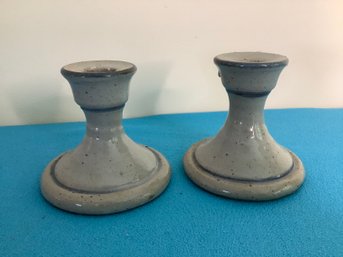 PAIR OF GLAZED POTTERY CANDLESTICK HOLDERS
