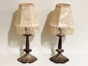 A Pair Of Bronze Candlesticks With Shades