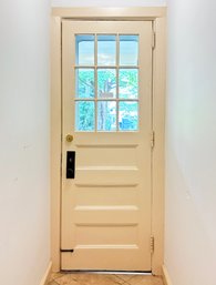 An Antique Exterior 9-Lite Door And Modern Storm