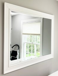 A Modern Beveled Mirror In Wood Frame