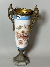 AN ORMALU MOUNTED URN WITH CHERUBS