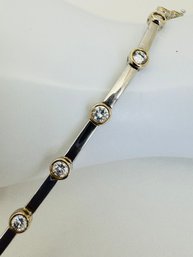 PRETTY STERLING SILVER BEZEL SET CZ'S WITH GOLD OVER STERLING SILVER AROUND STONES BRACELET