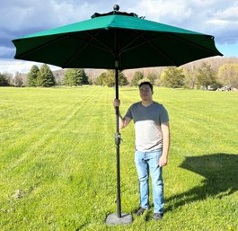 A Patio Umbrella With Cast Iron Base By Sunbrella