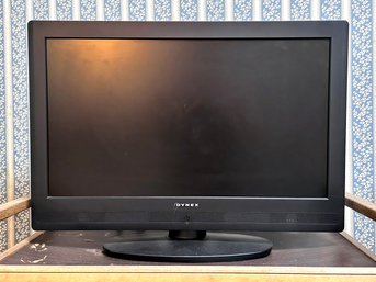 A 27' Dynex Flat Screen TV On Stand