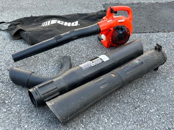 An Echo Gas Powered Leaf Blower And Accessories