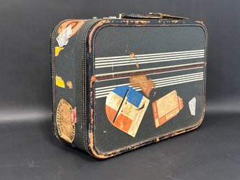 A Fabulous Vintage Suitcase With International Stickers