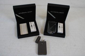 Pair Of New In Boxes Saberlight Rechargable Lighters