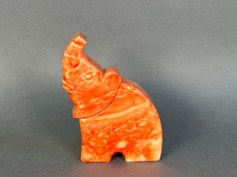 A Beautiful Orange Stone Elephant Figurine