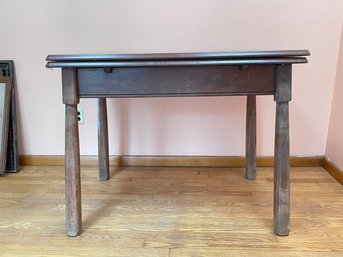 A 1920's Enamel Top Kitchen Table With Extendable Leaves