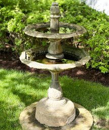 A Cast Stone And Iron Garden Fountain