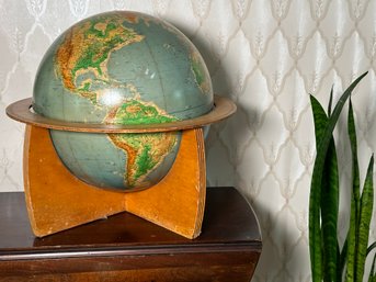 A Globe On A Unique Wooden Frame