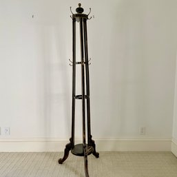 An Ebonized Painted Coat Rack With Ornate Design On Legs