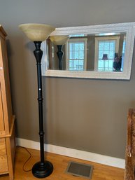 TORCHIERE FLOOR LAMP AND A PAINTED MIRROR