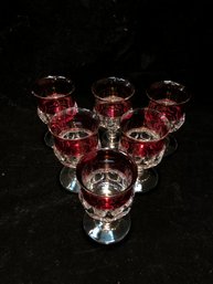 Red And Clear Stemmed Glasses