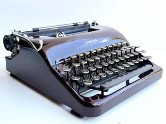 A Vintage Corona Typewriter In Case