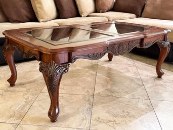 A Paneled Glass Coffee Table In French Provincial Style