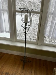 A WROUGHT IRON CANDLE SCONCE