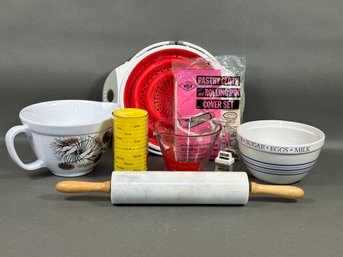 A Great Assortment Of Kitchen Items: Bowls, Measuring Cups & More