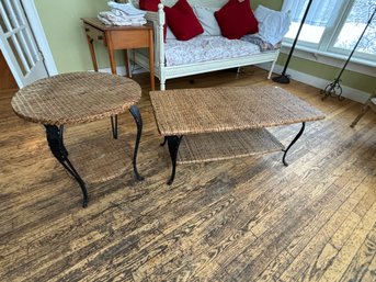 AN IRON AND RATTAN COFFEE TABLE AND SIDE TABLE