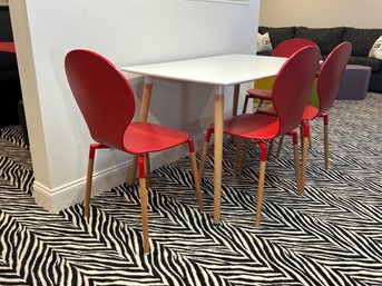 A Set Of Modern Bent Wood Dining Chairs And A Table