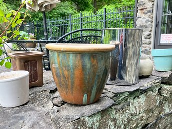 An Assortment Of Smaller Pots And Planters