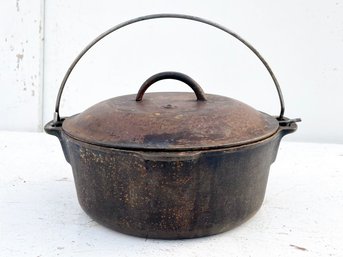 An Antique Cast Iron Bean Pot