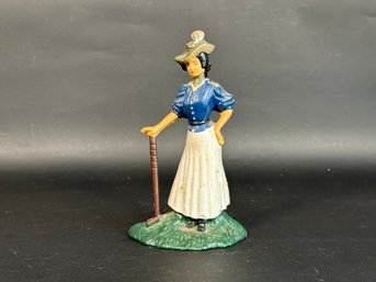 A Vintage Cast Iron Doorstop: Victorian Female Golfer