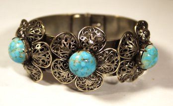 JOSEFF HOLLYWOOD LARGE HINGED CUFF BRACELET HAVING TURQUOISE COLORED STONES