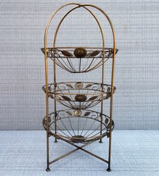 A Three Tiered Metal Serving Basket