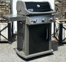 A Weber Spirit Propane Gas Grill - Cover Included