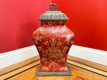 A Large Lidded Urn On Metal Base