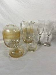Bejeweled Champagne Glasses And Clear Glass Vases And Pitcher