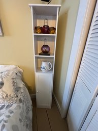 A DECORATIVE WHITE CABINET