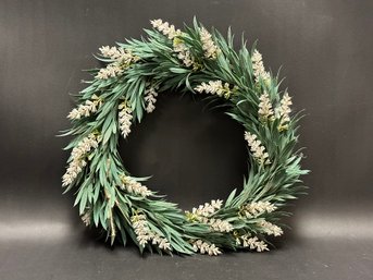 A Pretty Wreath With Slender Greens & Blooming Stalks