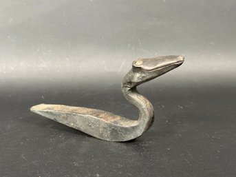 A Whimsical Snake Made From A Railroad Spike