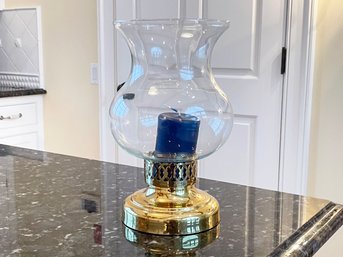 A Brass And Glass Hurricane Candle Holder