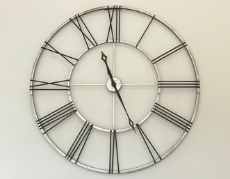 A Large Industrial Chic Wall Clock By Howard Miller