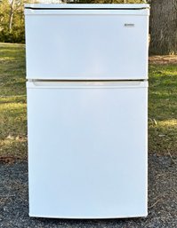 A Bar Fridge And Freezer Combo By Kenmore