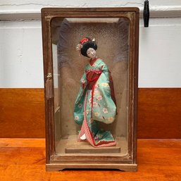 A Vintage Japanese Geisha Figurine In Glass Case