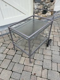 A Vintage Brown And Jordan Aluminum Tea Cart And 23' Round Table