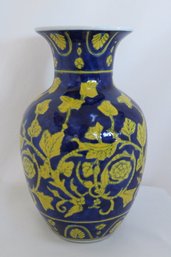 A Colorful Cobalt Blue And Mustard Yellow Floral Vessel