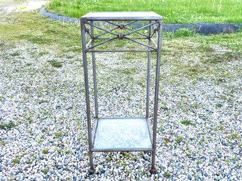 A Wrought Iron Glass Top Plant Stand Or Pedestal With Shelf