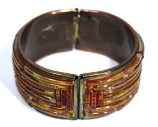 Hinged Cuff Bracelet In Brass Having Glass Inlay Strips In Red