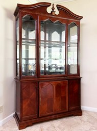 A Vintage Cherry Wood China Cabinet In Federal Style