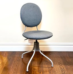 An Adjustable Height Padded Swivel Stool With Nailhead Trim In Grey Linen