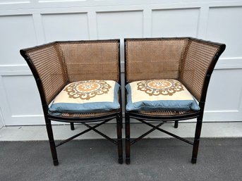 A Pair Of Caned Corner Chairs With Cushions (i)