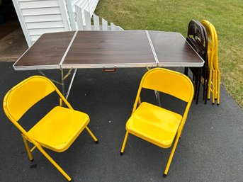 Yellow Krueger Folding Chairs And A Folding Table