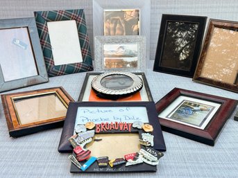 An Assortment Of Small Photo Frames