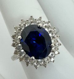 SIGNED DK STERLING SILVER BLUE AND WHITE SAPPHIRE RING